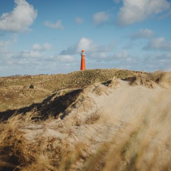 red-lighhouse-in-dunes-of-schiermonnikoog-netherl-2024-12-05-05-34-20-utc